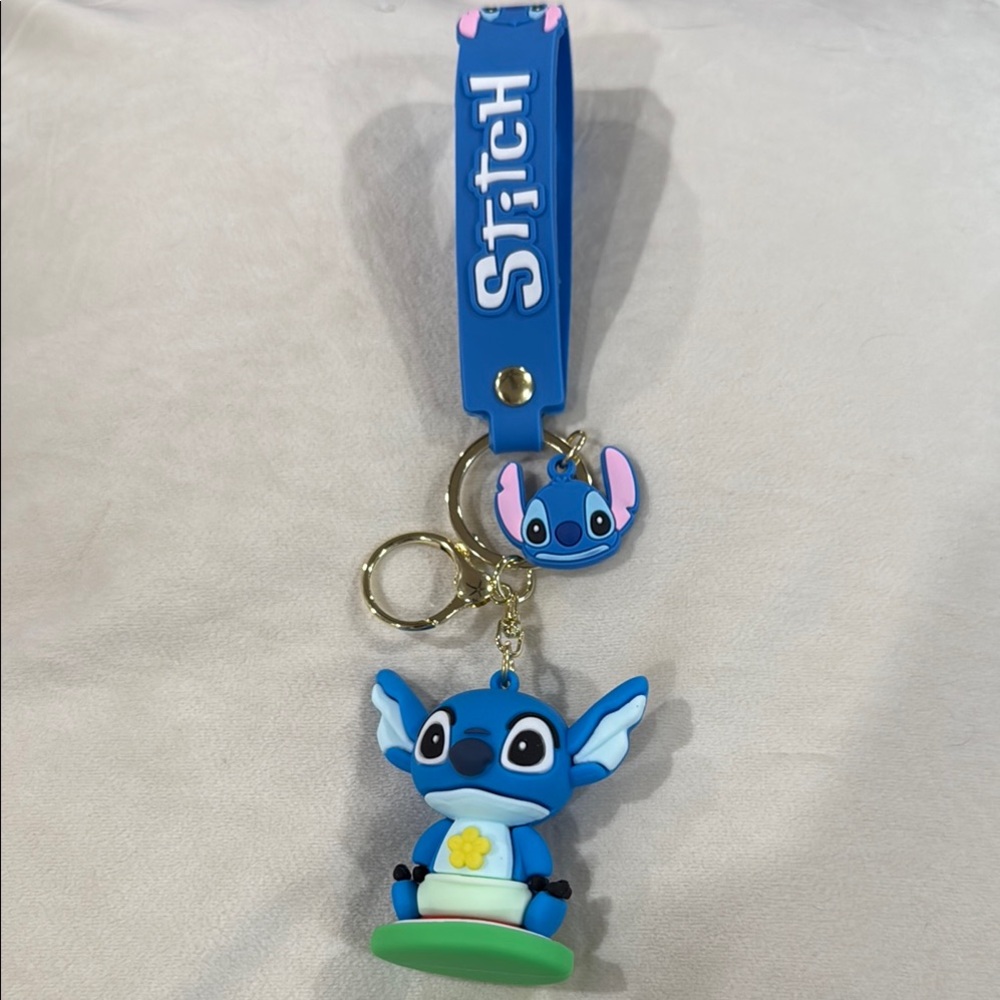 Blue Stitch Keychain with a small Stitch face